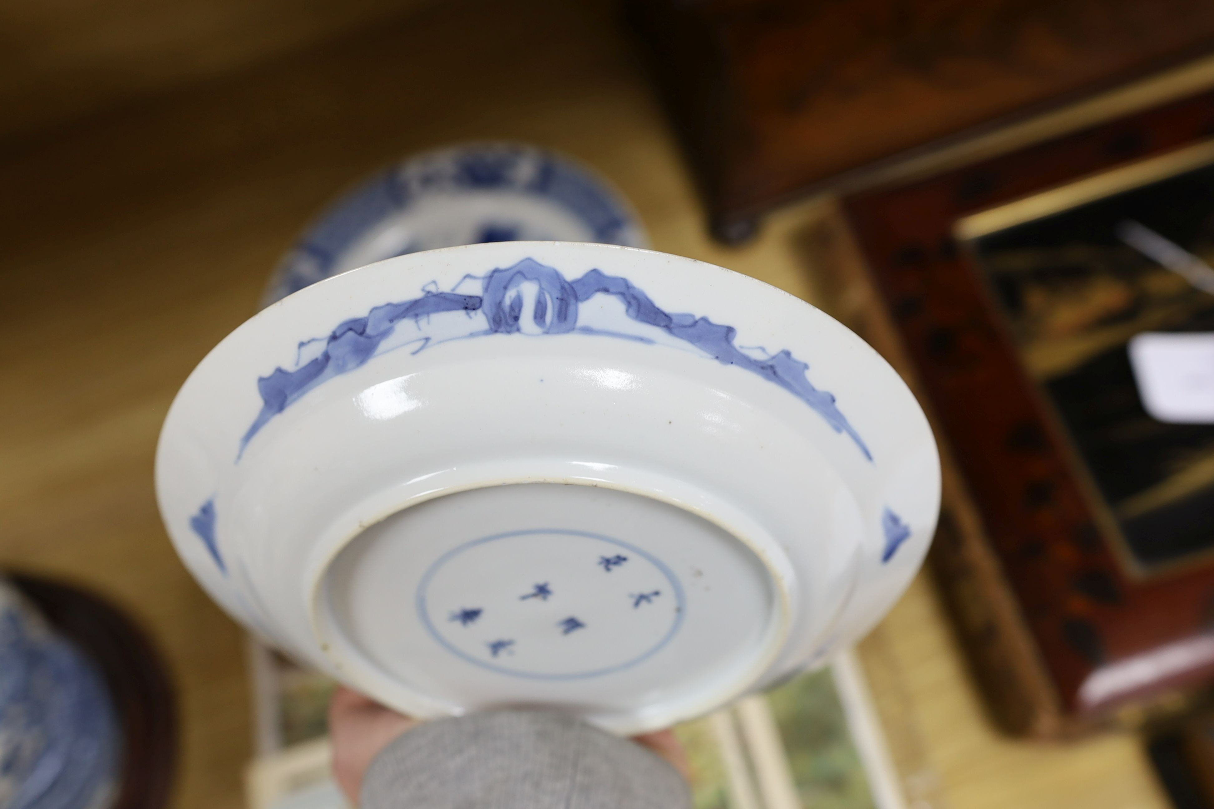 Two Chinese blue and white plates, Kangxi period, one with Kangxi mark the other a Chenghua mark, 21 cms diameter